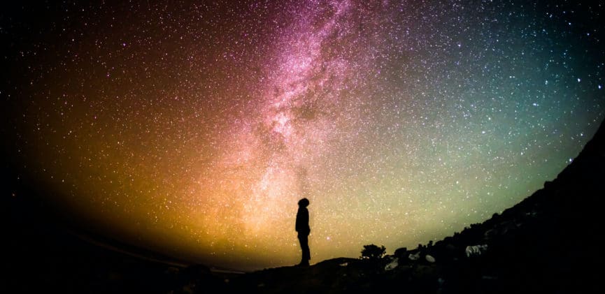 person standing under night sky